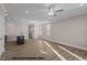 Open-concept living area with recessed lighting, plank flooring, and bright windows at 133 Pearl St # 7, Garner, NC 27529
