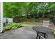 Backyard features a patio, wrought iron furniture and lush landscaping at 13338 Ashford Park Dr, Raleigh, NC 27613