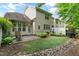 Well-maintained backyard with patio, lush lawn and landscaping at 13338 Ashford Park Dr, Raleigh, NC 27613