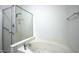 Bright bathroom with a shower and luxurious soaking tub at 13338 Ashford Park Dr, Raleigh, NC 27613