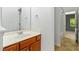 Bright bathroom featuring a mirror over a wooden vanity at 13338 Ashford Park Dr, Raleigh, NC 27613