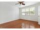 Spacious bedroom with hardwood floors and bright windows at 13338 Ashford Park Dr, Raleigh, NC 27613