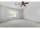 Bedroom with a large window offering ample natural light and neutral paint at 13338 Ashford Park Dr, Raleigh, NC 27613