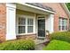 Charming front door with flower accent and stone details at 13338 Ashford Park Dr, Raleigh, NC 27613