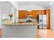 Kitchen island with granite countertops and stainless steel appliances at 13338 Ashford Park Dr, Raleigh, NC 27613