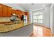 Kitchen island with stainless steel appliances and granite countertops at 13338 Ashford Park Dr, Raleigh, NC 27613
