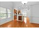 Bright kitchen with wood floors, granite counters, and wine rack at 13338 Ashford Park Dr, Raleigh, NC 27613
