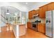 Kitchen with stainless steel appliances and view to living room at 13338 Ashford Park Dr, Raleigh, NC 27613