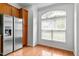 Bright kitchen featuring stainless steel refrigerator and window at 13338 Ashford Park Dr, Raleigh, NC 27613
