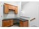 A compact office space boasts custom cabinets and a granite countertop desk at 13338 Ashford Park Dr, Raleigh, NC 27613