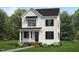 Charming two-story home with a modern farmhouse style and inviting front porch at 1348 Hurston Ln, Knightdale, NC 27545