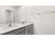 Bathroom featuring a light gray double vanity with quartz countertop and a white framed mirror at 138 Fair Child Rd, Spring Lake, NC 28390