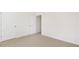 Bedroom with neutral carpeting and two doors at 138 Fair Child Rd, Spring Lake, NC 28390