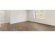 Bedroom with wood floors, large window, and white walls at 138 Fair Child Rd, Spring Lake, NC 28390