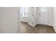 Foyer with dark wood-look flooring and natural light, featuring a glass paneled door to another room at 138 Fair Child Rd, Spring Lake, NC 28390