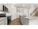 Kitchen with gray cabinetry, stainless steel appliances, granite countertops, and wood-look flooring at 138 Fair Child Rd, Spring Lake, NC 28390