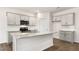 Kitchen with gray cabinetry, stainless steel appliances, granite countertops, and wood-look flooring at 138 Fair Child Rd, Spring Lake, NC 28390