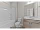 Bathroom features a bathtub with shower and a vanity at 141 Pearl St # 9, Garner, NC 27529