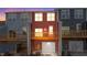 Exterior rear of townhome showing a garage, deck and colorful siding at 141 Pearl St # 9, Garner, NC 27529