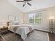 Bedroom with ceiling fan, area rug, and windows at 1605 Grace Point Rd, Morrisville, NC 27560