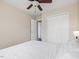 Bedroom featuring hardwood floors, a ceiling fan, and a spacious closet with view to hallway at 1605 Grace Point Rd, Morrisville, NC 27560