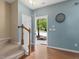 View of the home's entry featuring wood floors, stairs and a welcome atmosphere at 1605 Grace Point Rd, Morrisville, NC 27560