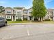 Charming townhomes feature varied exteriors, well-manicured landscaping, and convenient parking at 1605 Grace Point Rd, Morrisville, NC 27560