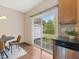 Kitchen area with a sliding glass door that views backyard at 1605 Grace Point Rd, Morrisville, NC 27560