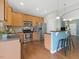 Modern kitchen with stainless steel appliances, granite countertops, and a convenient breakfast bar at 1605 Grace Point Rd, Morrisville, NC 27560