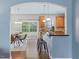 View of the kitchen with stainless steel appliances, wood cabinets, and breakfast bar at 1605 Grace Point Rd, Morrisville, NC 27560