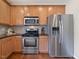 Kitchen featuring stainless steel appliances and granite countertops at 1605 Grace Point Rd, Morrisville, NC 27560