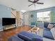 Comfortable living room with a cozy seating area, wood floors, and ample natural light at 1605 Grace Point Rd, Morrisville, NC 27560