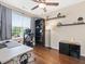 Modern home office with hardwood floors, a large window, desk, shelving, and stylish decor at 1605 Grace Point Rd, Morrisville, NC 27560
