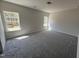 New bedroom with neutral walls, gray carpet, and two bright windows at 172 Knoll Way, Sanford, NC 27332