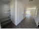 Bright entryway with hardwood floors, staircase, and natural light from nearby windows at 172 Knoll Way, Sanford, NC 27332