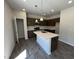 Modern kitchen with stainless steel appliances, a center island, and ample counter space at 172 Knoll Way, Sanford, NC 27332
