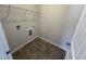The laundry room includes tile floors and a wire shelf at 172 Knoll Way, Sanford, NC 27332