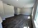 Spacious living room features hardwood floors and plenty of natural light at 172 Knoll Way, Sanford, NC 27332