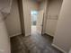 New walk-in closet with neutral walls, gray carpet, and closet storage at 172 Knoll Way, Sanford, NC 27332