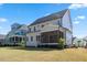 Features a spacious backyard, ideal for outdoor activities, with a charming screened porch perfect for relaxing and entertaining at 1724 Deacon Falls Way, Wendell, NC 27591