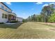 Features a spacious backyard, ideal for outdoor activities, with a charming screened porch perfect for relaxing and entertaining at 1724 Deacon Falls Way, Wendell, NC 27591