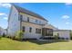 Spacious backyard featuring lush green lawn and a screened porch offering an ideal space for outdoor relaxation and entertaining at 1724 Deacon Falls Way, Wendell, NC 27591