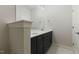 Bathroom featuring double sinks, dark blue cabinets and marble floors at 1724 Deacon Falls Way, Wendell, NC 27591