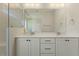 Bathroom featuring a double sink vanity, shower with glass door, and modern fixtures at 1724 Deacon Falls Way, Wendell, NC 27591