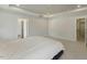 Bedroom featuring tray ceiling, plush carpet, and access to ensuite bathroom and walk-in closet at 1724 Deacon Falls Way, Wendell, NC 27591