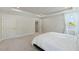 Comfortable bedroom with plush carpet, natural light, and neutral paint colors at 1724 Deacon Falls Way, Wendell, NC 27591