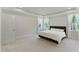 Bright bedroom with plush carpet, natural light, and a comfortable queen size bed at 1724 Deacon Falls Way, Wendell, NC 27591