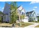 Attractive two-story home with white siding, blue shutters, and a manicured front yard at 1724 Deacon Falls Way, Wendell, NC 27591