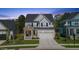 Charming two-story home featuring a brick entryway, white siding, and a well-maintained lawn at 1724 Deacon Falls Way, Wendell, NC 27591