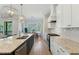 Beautiful kitchen with granite countertops, modern appliances, and open floor plan at 1724 Deacon Falls Way, Wendell, NC 27591